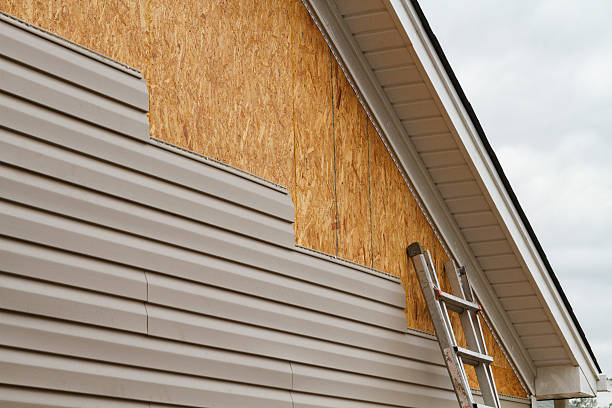 Professional Storm Damage Siding Repair technician working in Dallastown, PA